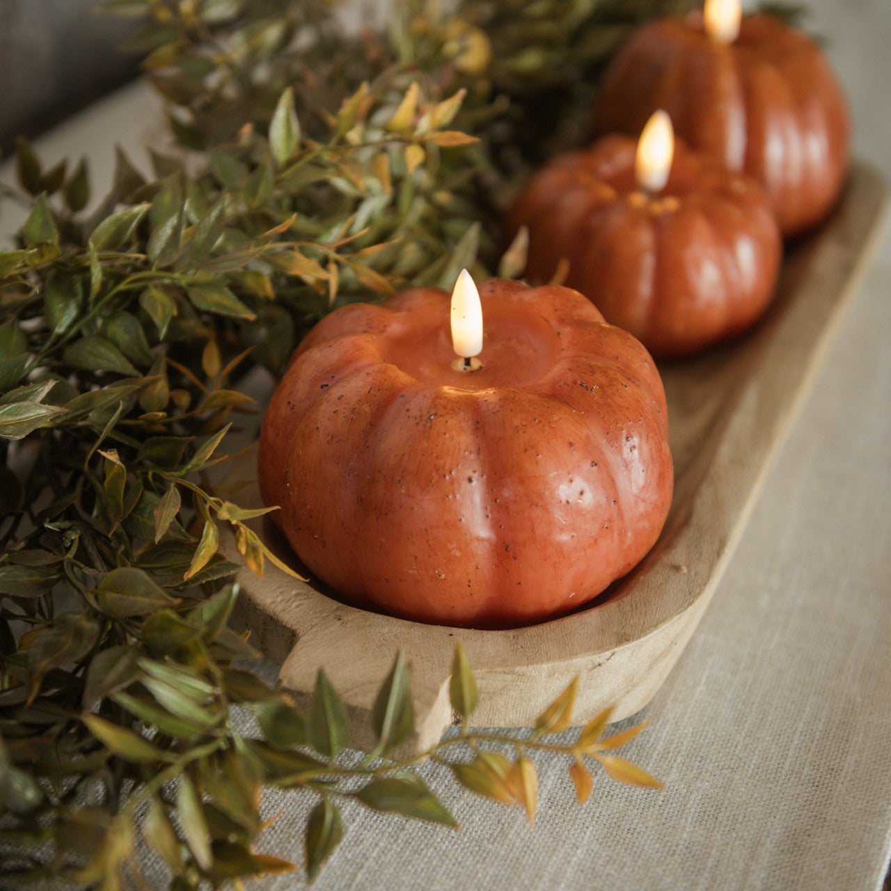 Battery Operated Pumpkin Candles show decorating a Thanksgiving Table