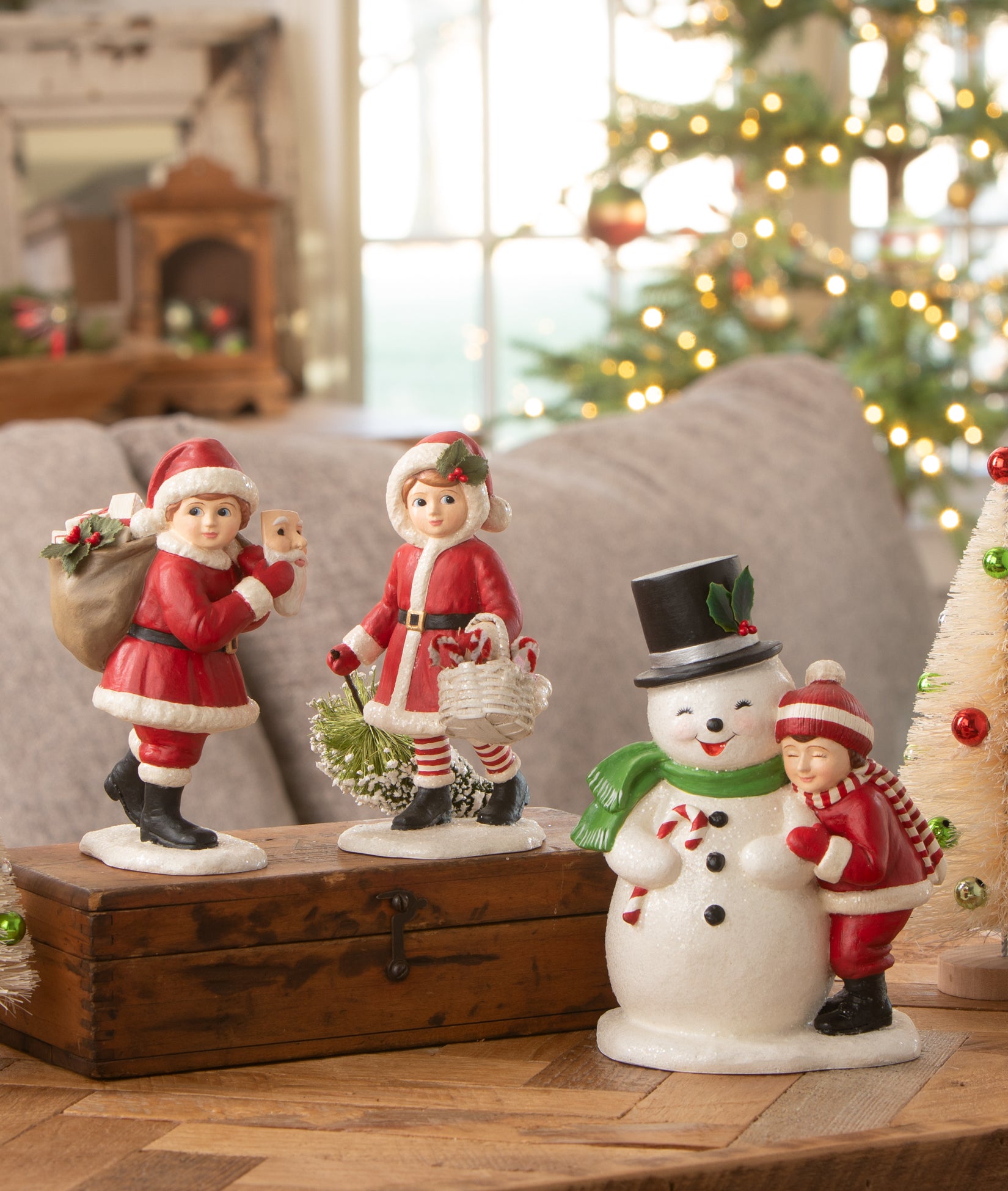 Bethany Lowe Christmas figurines decorate a coffee table