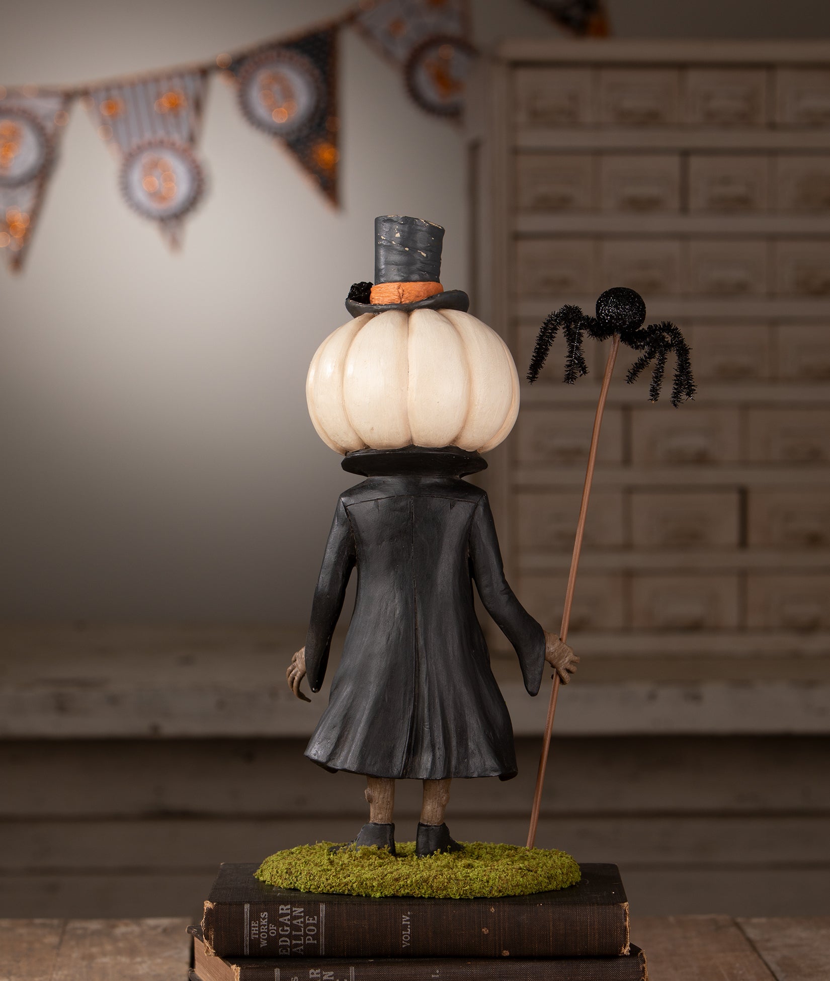 Bethany Lowe Mr. Gourdy's Night Out Halloween figurine shown backside.