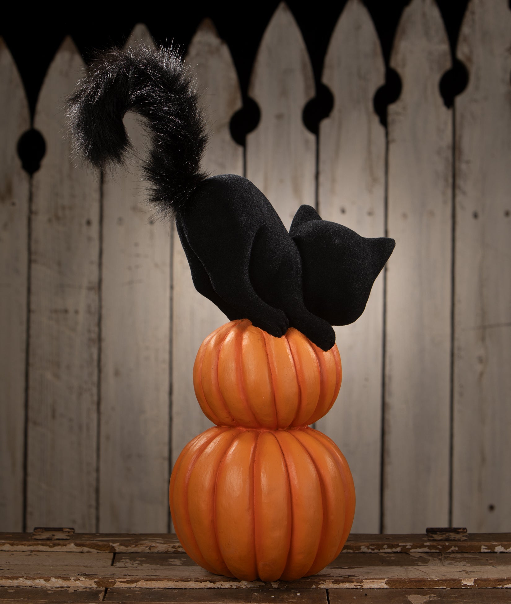 Black cat on top of two stacked pumpkins. Retro Halloween decoations by Bethany Lowe.