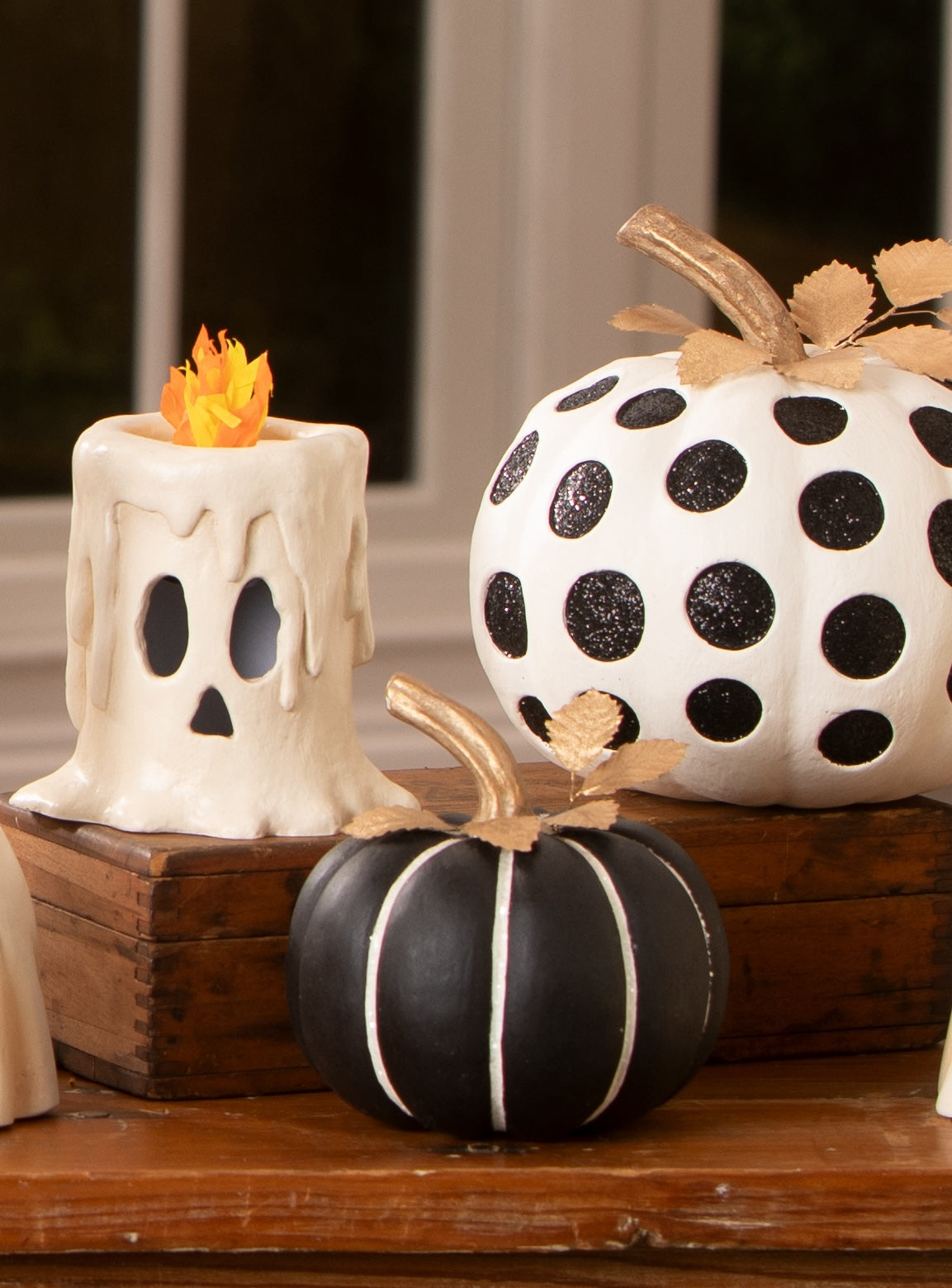Decorating a table with black and white Halloween decorations from the 2026 Bethany Lowe Collection.