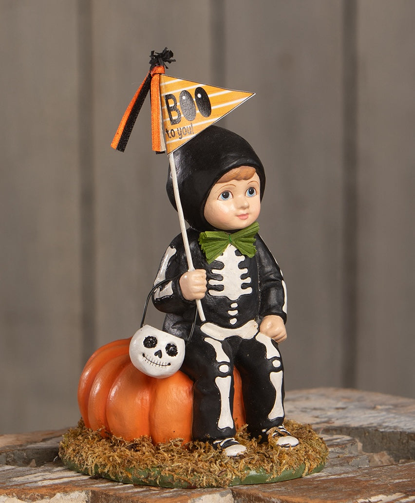 Boy in Skeleton Costume Figurine sitting on a pumpkin - Boo to You Oliver