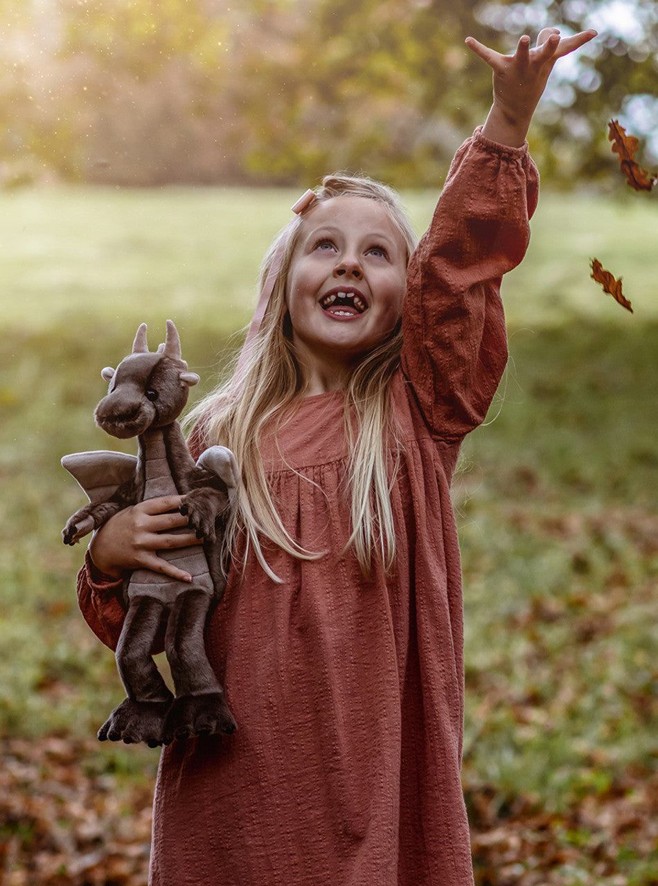 Girl Playing with Clubs Dragon by Charlie Bears