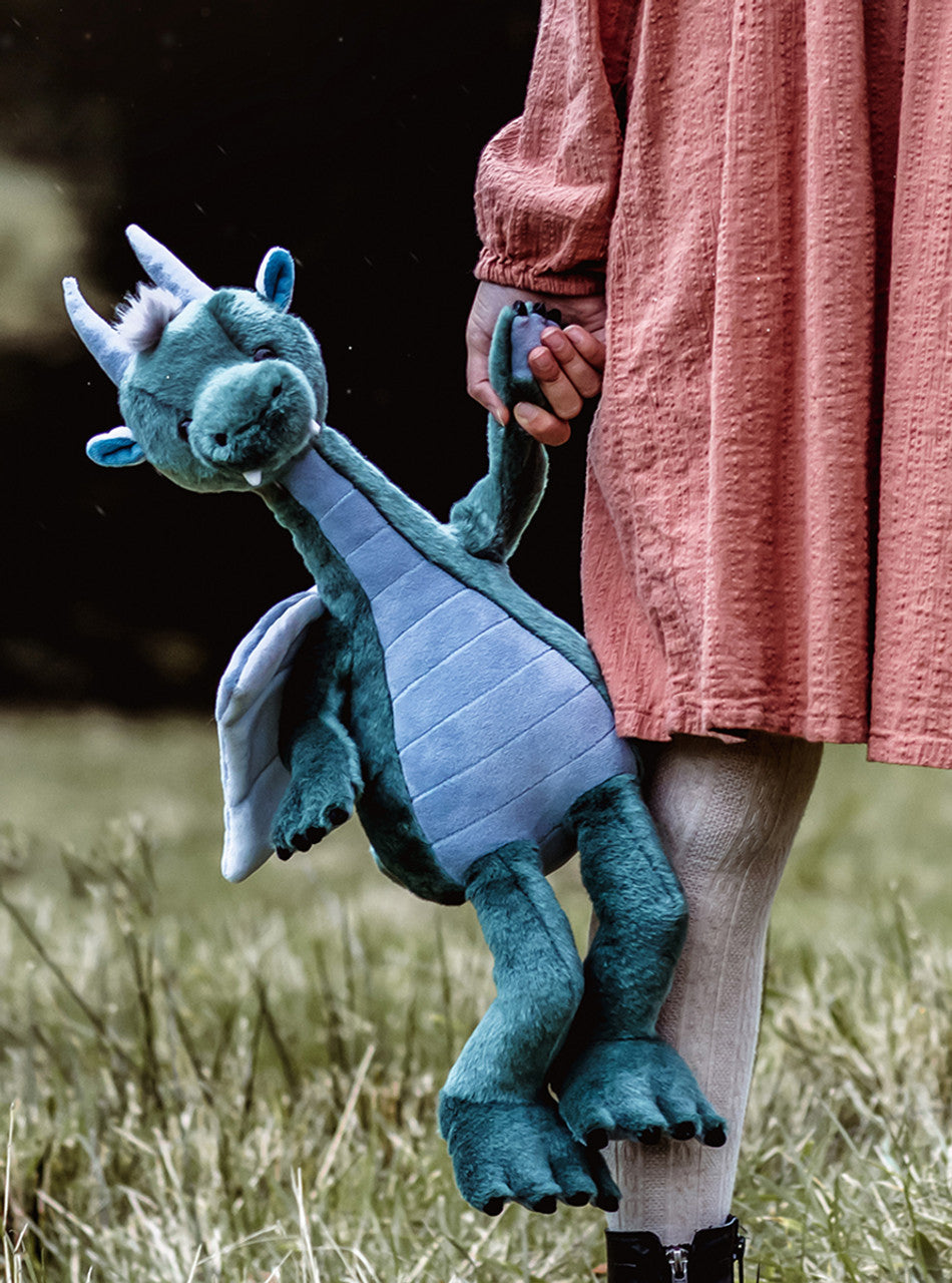 Child carrying Spades Dragon plush stuffed animal by Charlie Bears