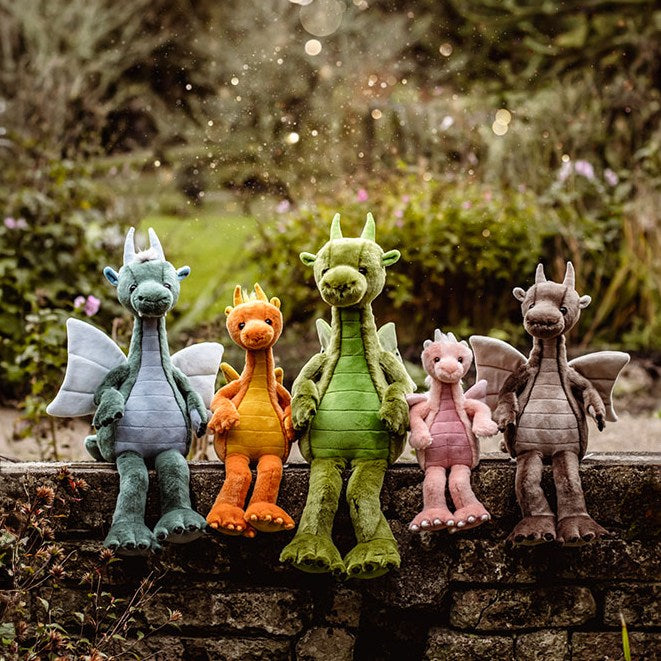 Charlie Bears Dragons shown in 5 colors and sizes, blue, orange, green, pink, and brown