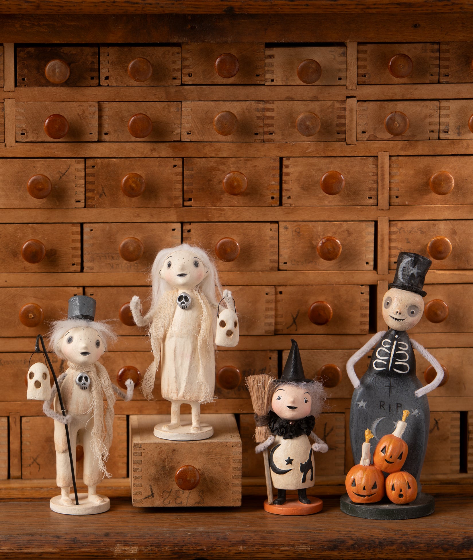 Cute Halloween figurines designed by artist Michelle Lauritsen. Figurines include; Haunting Henry Ghost, Ghostly Grace, Tombstone Trickster Skeleton, and Mabel Witch.