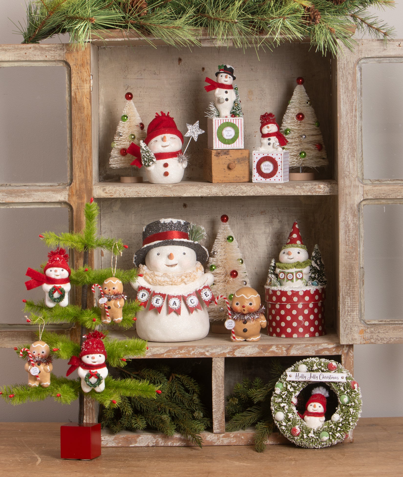 Hutch decorated with Cute Snowman Figurines and Gingerbread Boy Figurines by Michelle Allen of Raggedy Pants