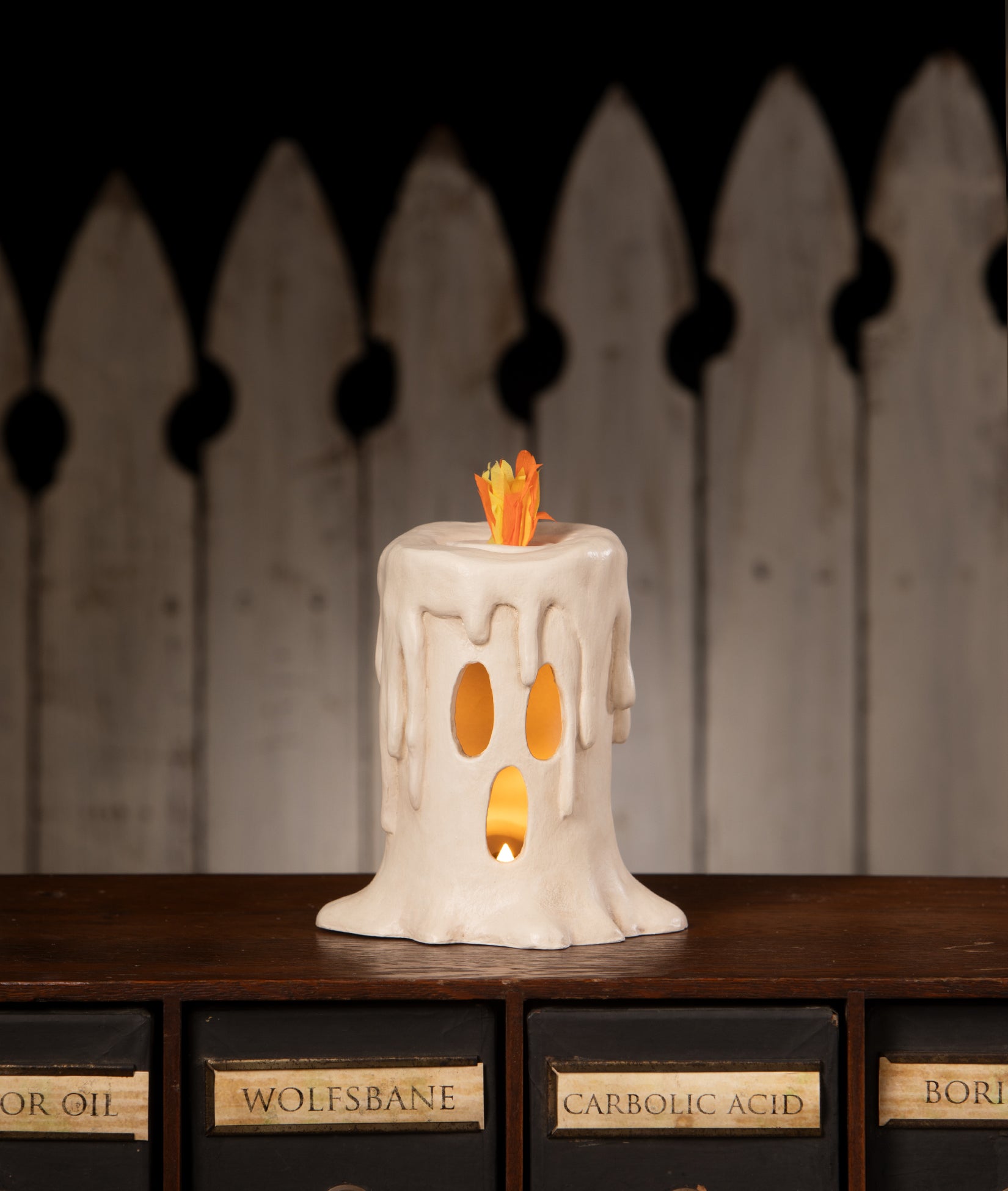 Flam'in Ghost Candle Luminary, tall - shown lit up with battery operated candle. From the Bethany Lowe Halloween Collection.