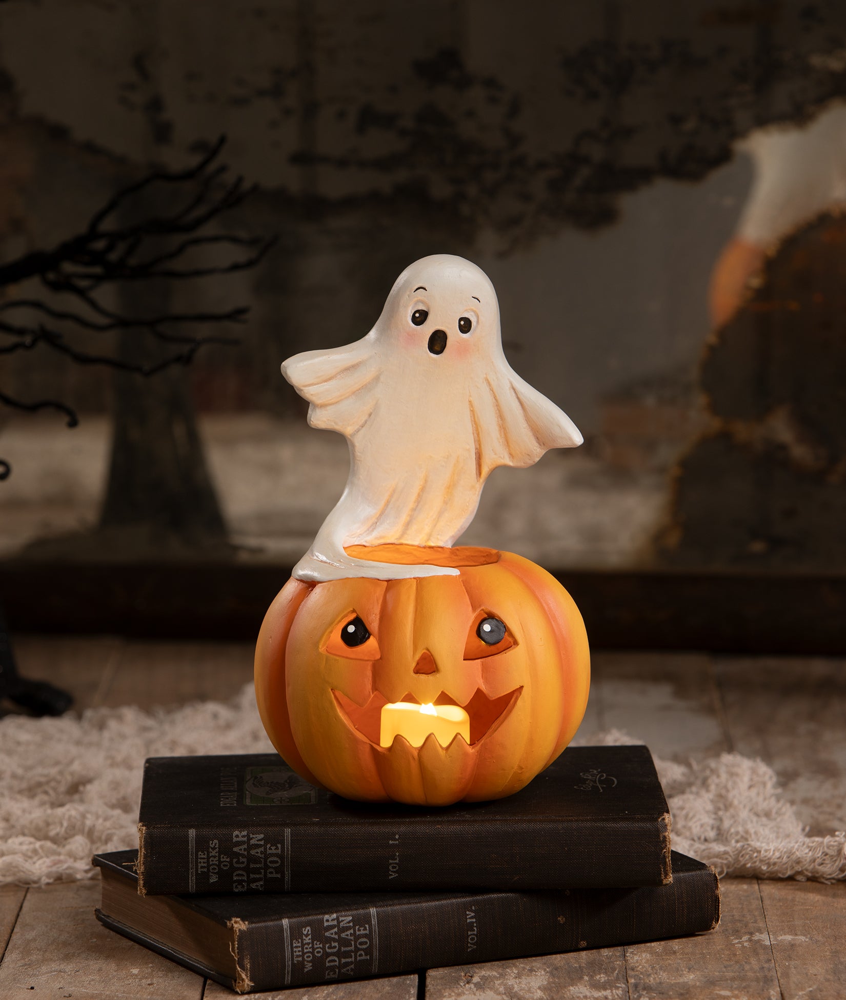 Ghost on Jack O'Lantern Candle Holder, shown lit up, from the Bethany Lowe Halloween Collection.