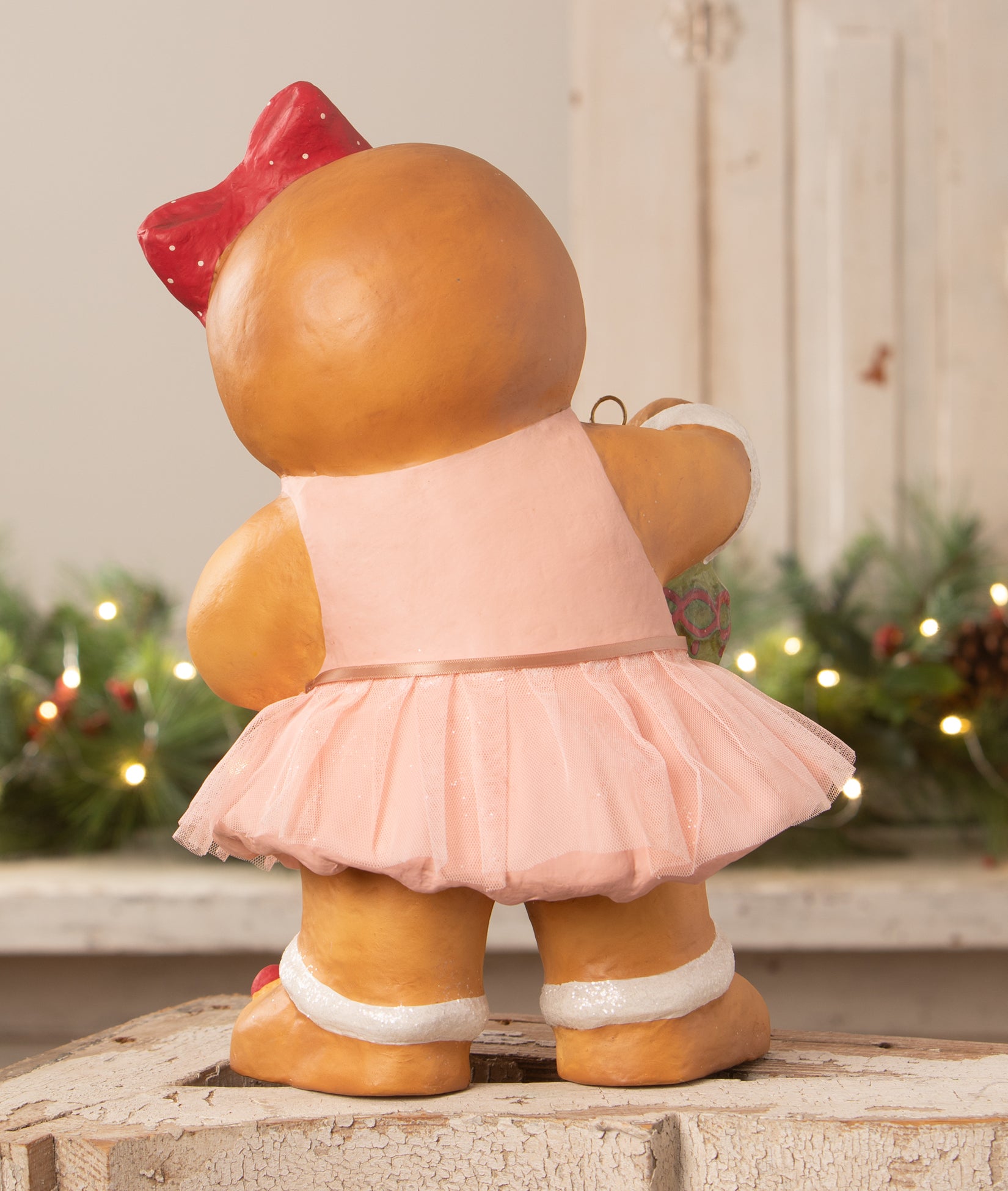 Paper Mache Gingerbread Girl, by Bethany Lowe, wearing pink dress.