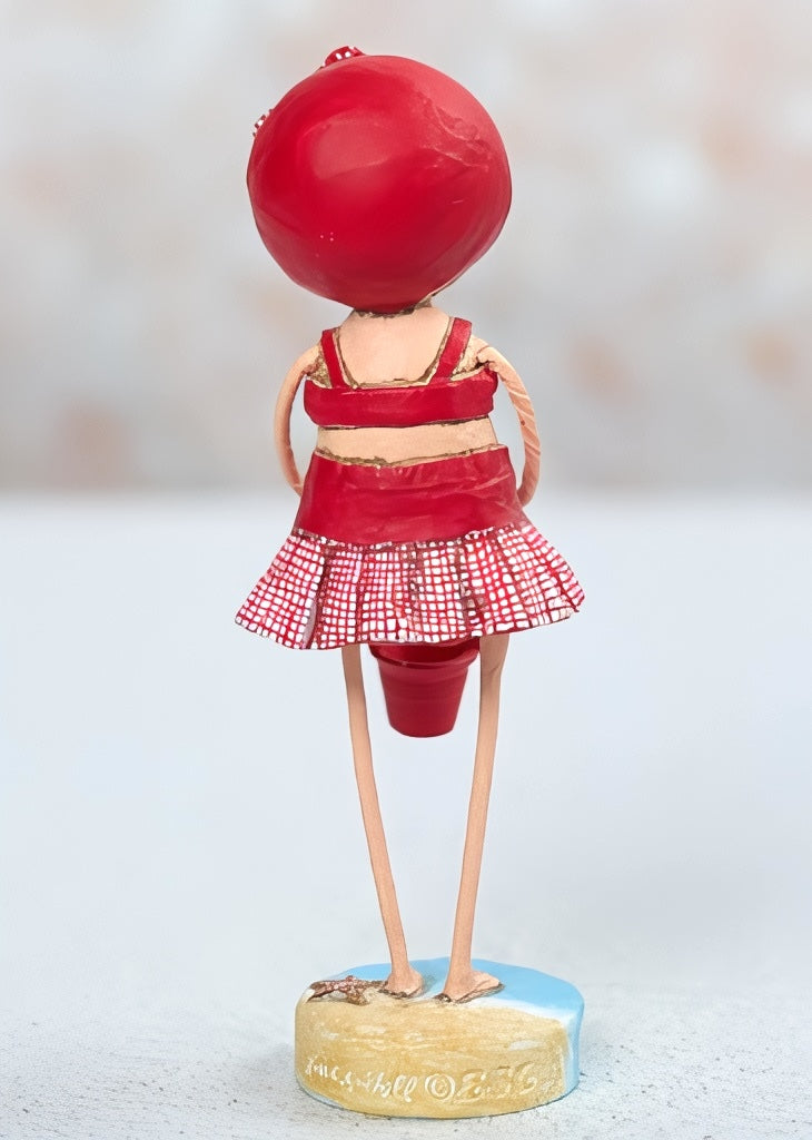 Lori Mitchell Summer Figurine - girl in a red bathingsuit at the beach with a sandpail.