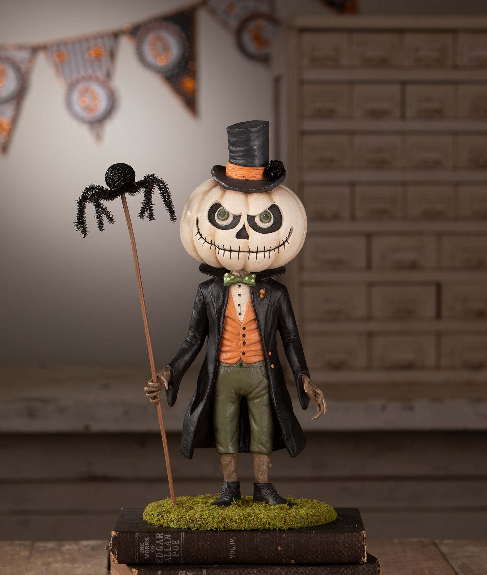 Mr. Gourdy's Night Out pumpkin head figurine from the 2026 Bethany Lowe Halloween Collection. Gourdy is dressed in a top hat and bow tie with a mischievous grin.