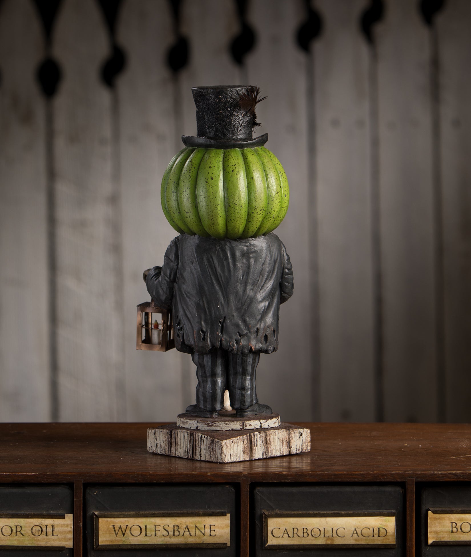 Mr. Hyde Pumpkin Head Figurine by Bethany Lowe shown backside