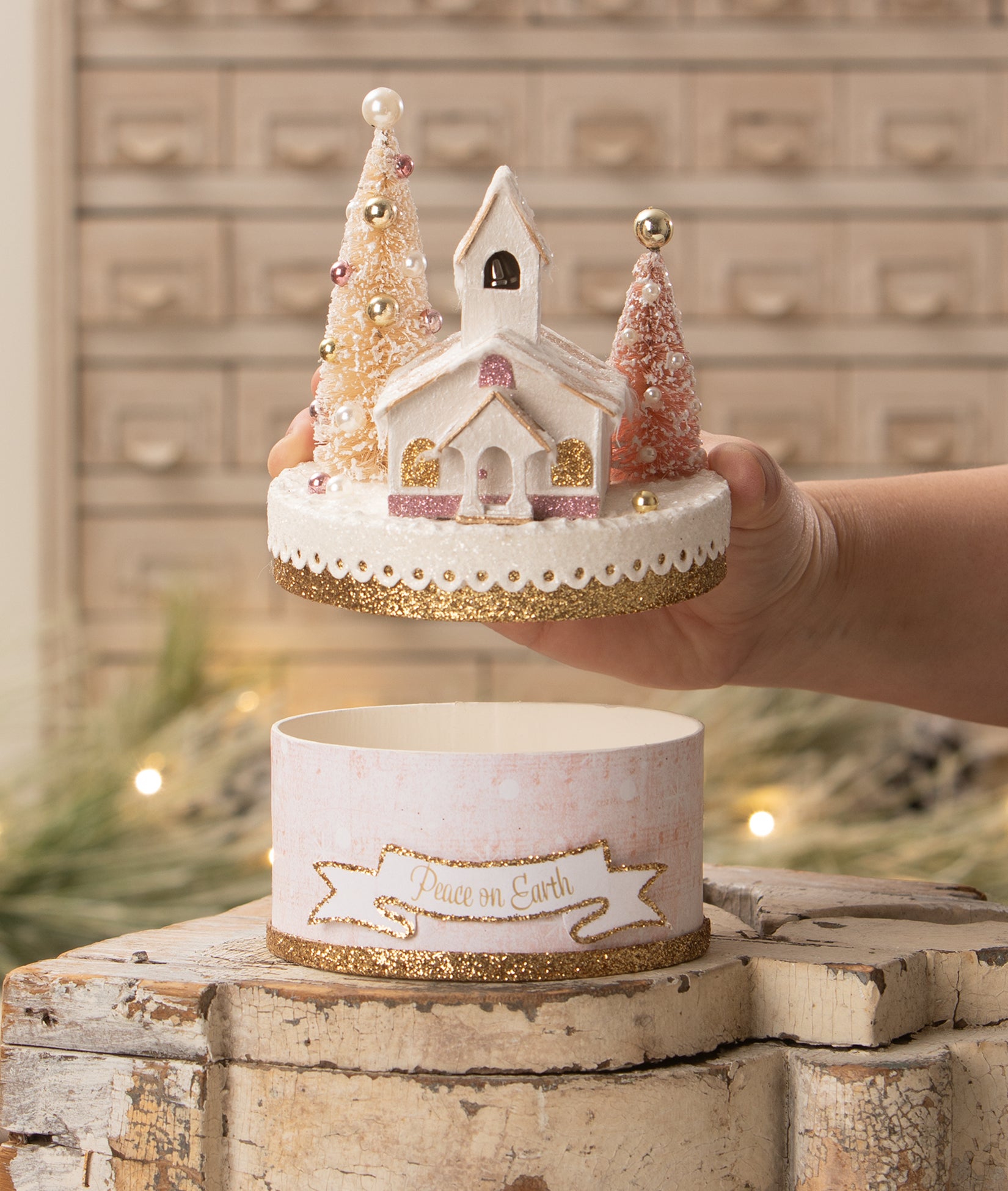 Peace on Earth Church on Box with Pink Christmas Decorations