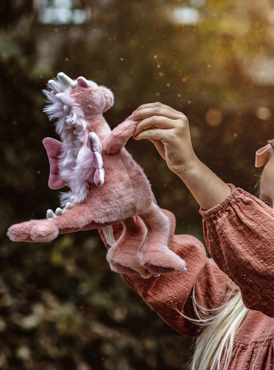 Child Playing with Hearts Pink Dragons Stuffed Animal by Charlie Bears