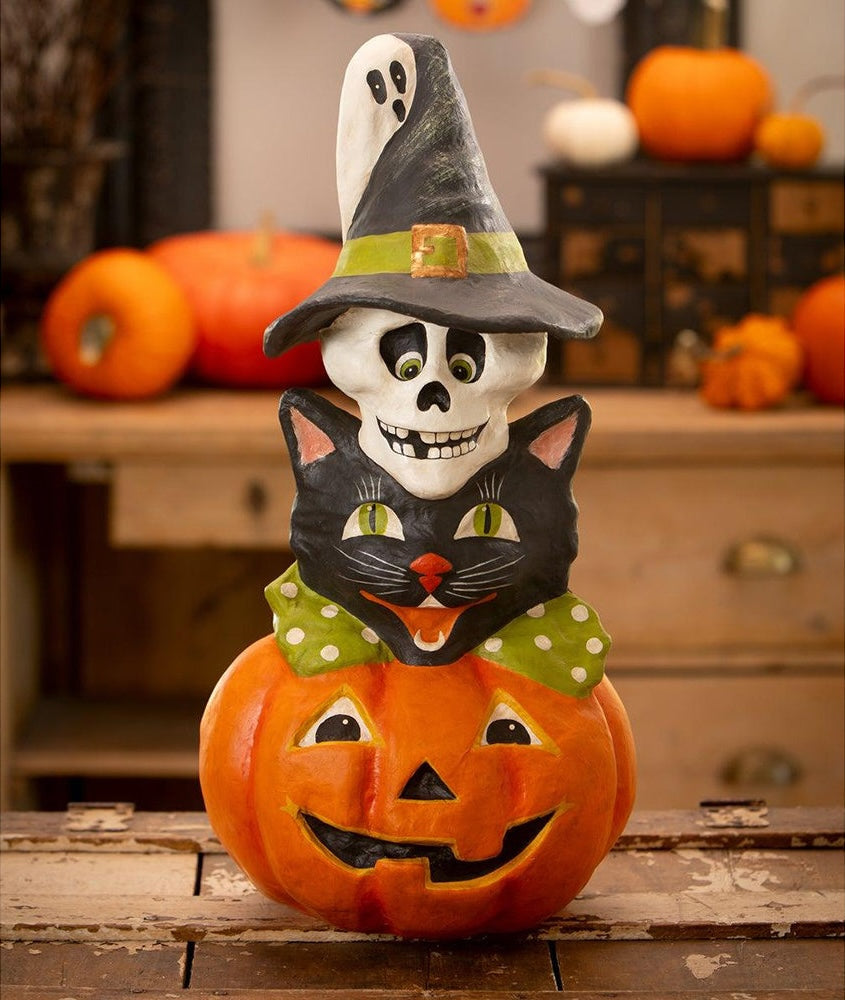 Retro Halloween Totem Stack featuring a ghost, witch, cat, and pumpkin. Halloween decorations made from paper mache inspired by the 1950's.