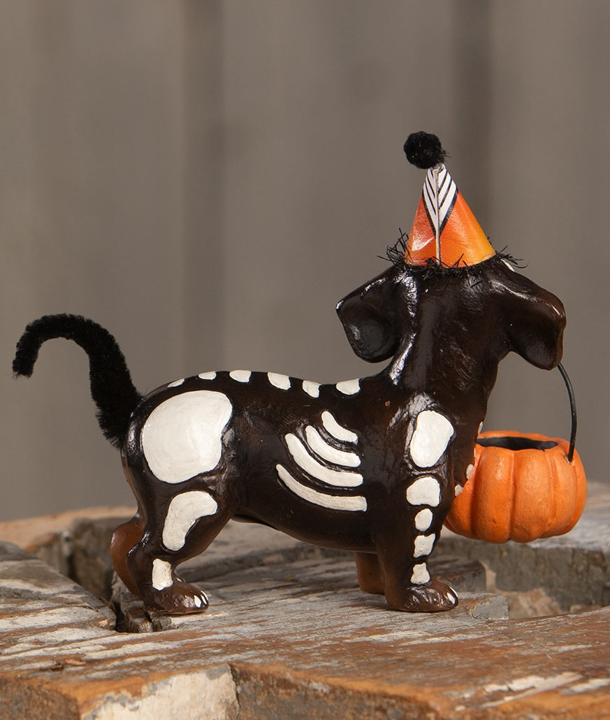 Skeleton Pup Figurine - a Dachshund dog dressed up in Halloween Costume