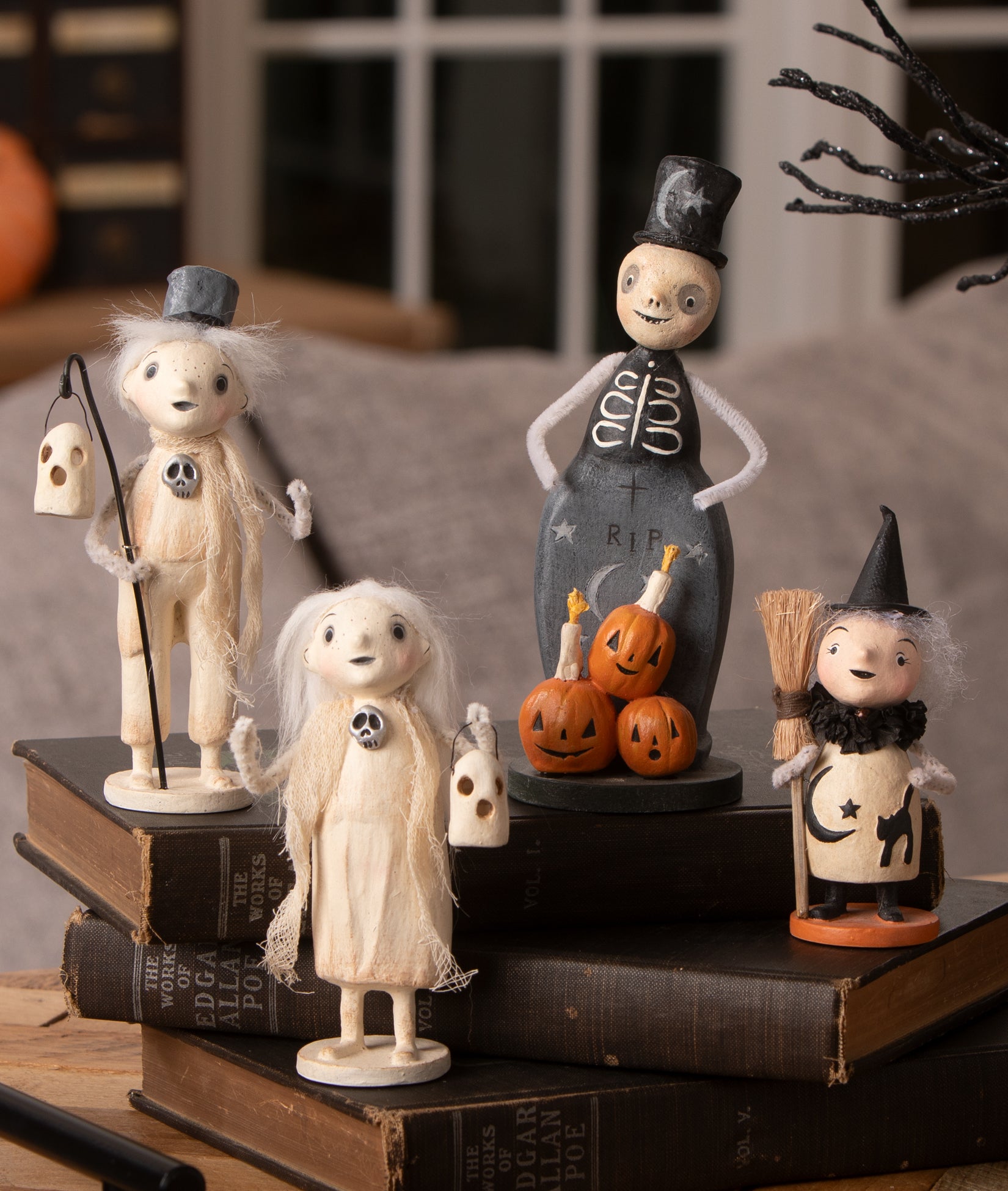 Unique and cute Halloween figurines designed by artist Michelle Lauritsen. Figurines include; Haunting Henry Ghost, Ghostly Grace, Tombstone Trickster Skeleton, and Mabel Witch.