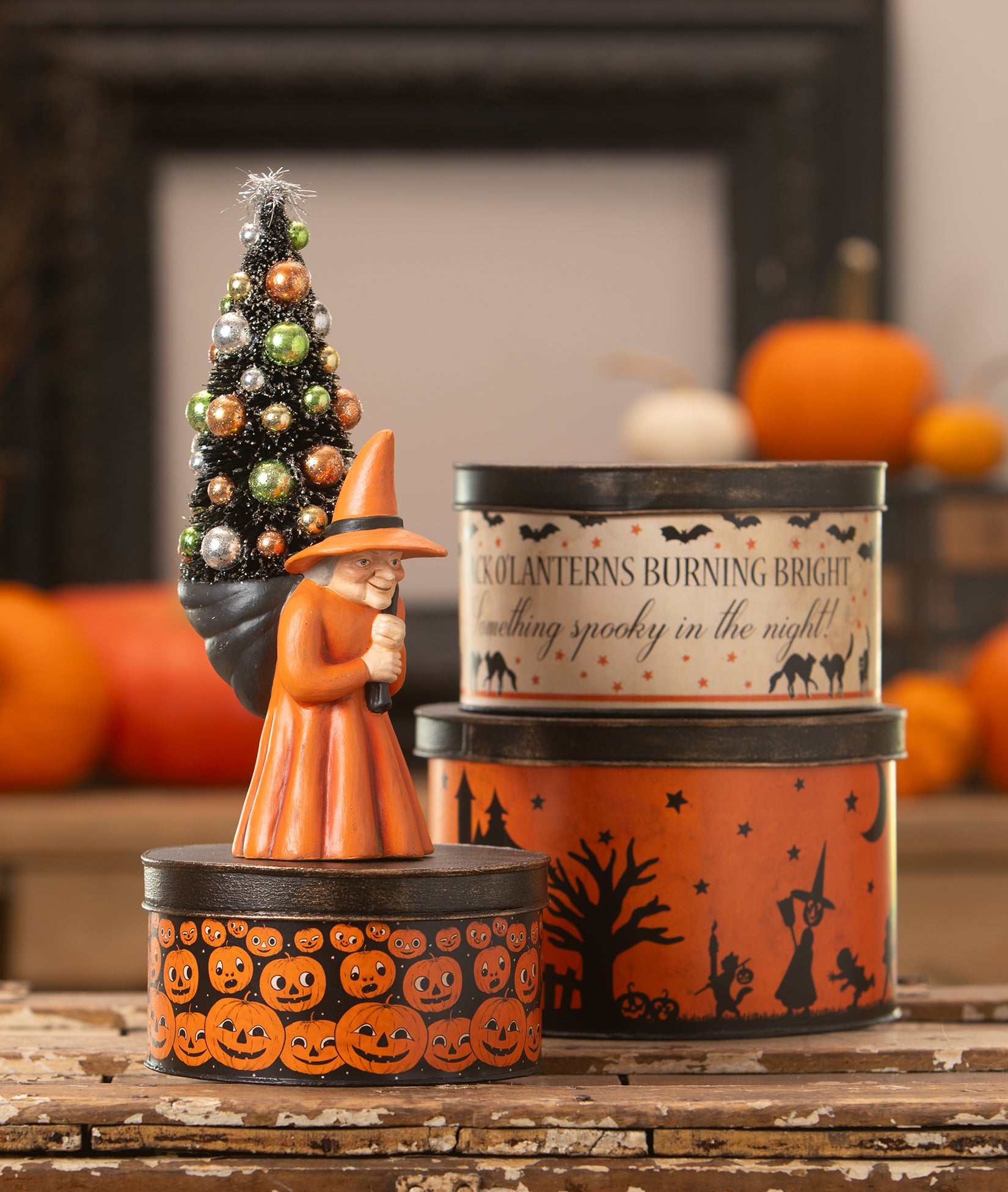 Vintage Style Halloween Decorations, reproduction round tins and a reproduction witch with tree
