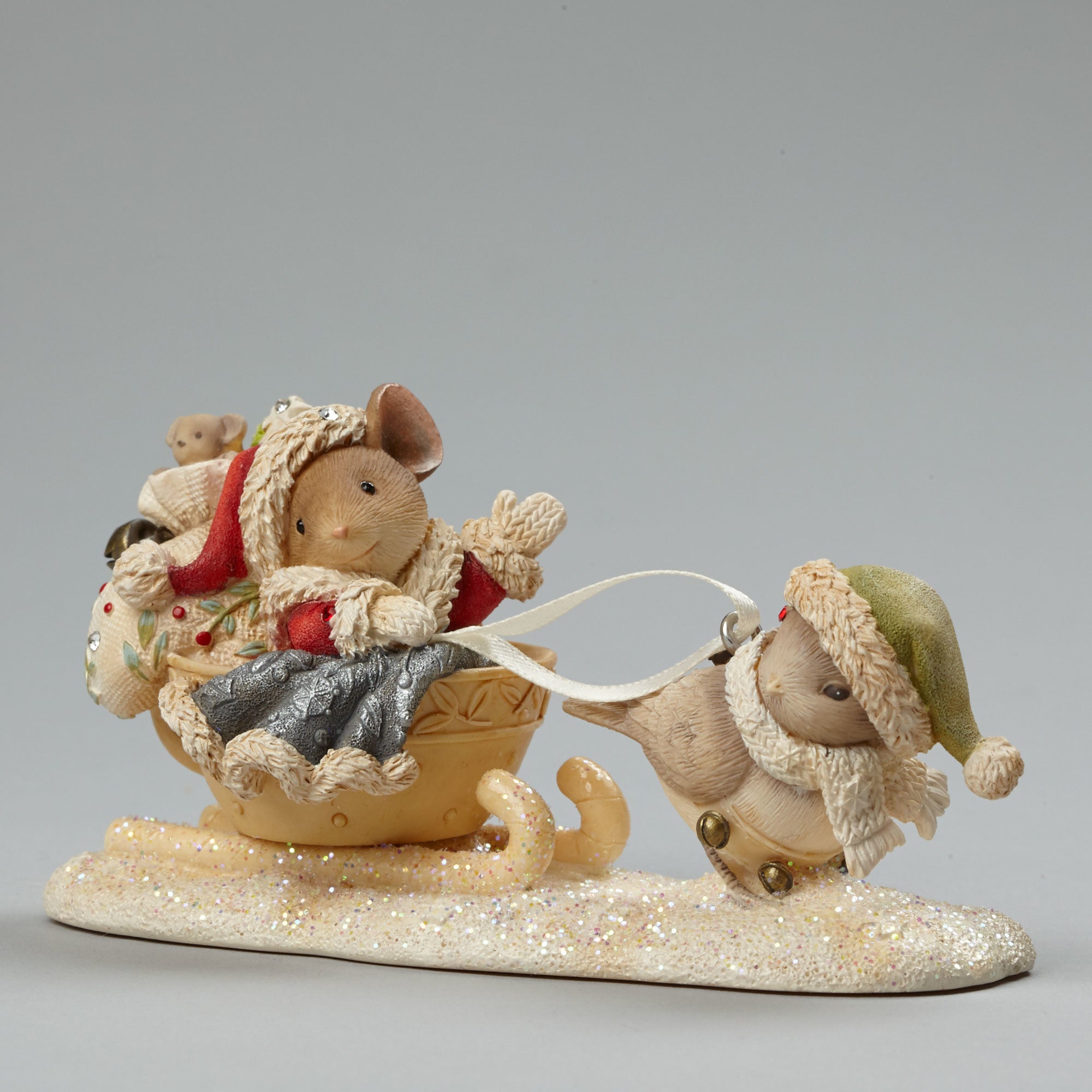 Mouse Dressed Up as Santa with Bird Pulling Sleigh