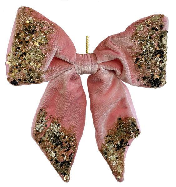 http://theholidaybarn.com/cdn/shop/products/pink-velvet-bow-ornament-with-gold-glitter_grande.jpg?v=1668391402