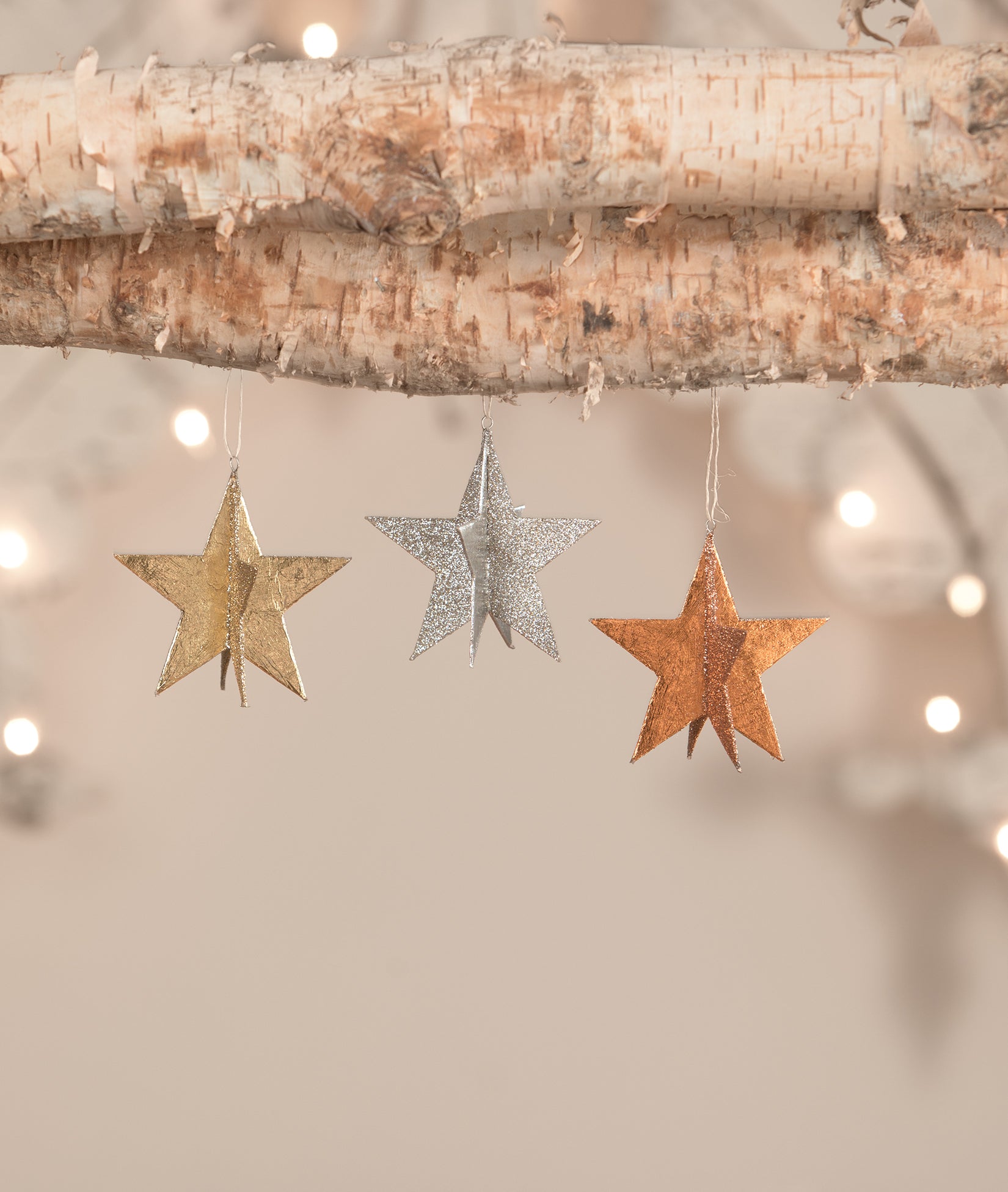 Metallic Star Ornaments in gold, silver, and copper
