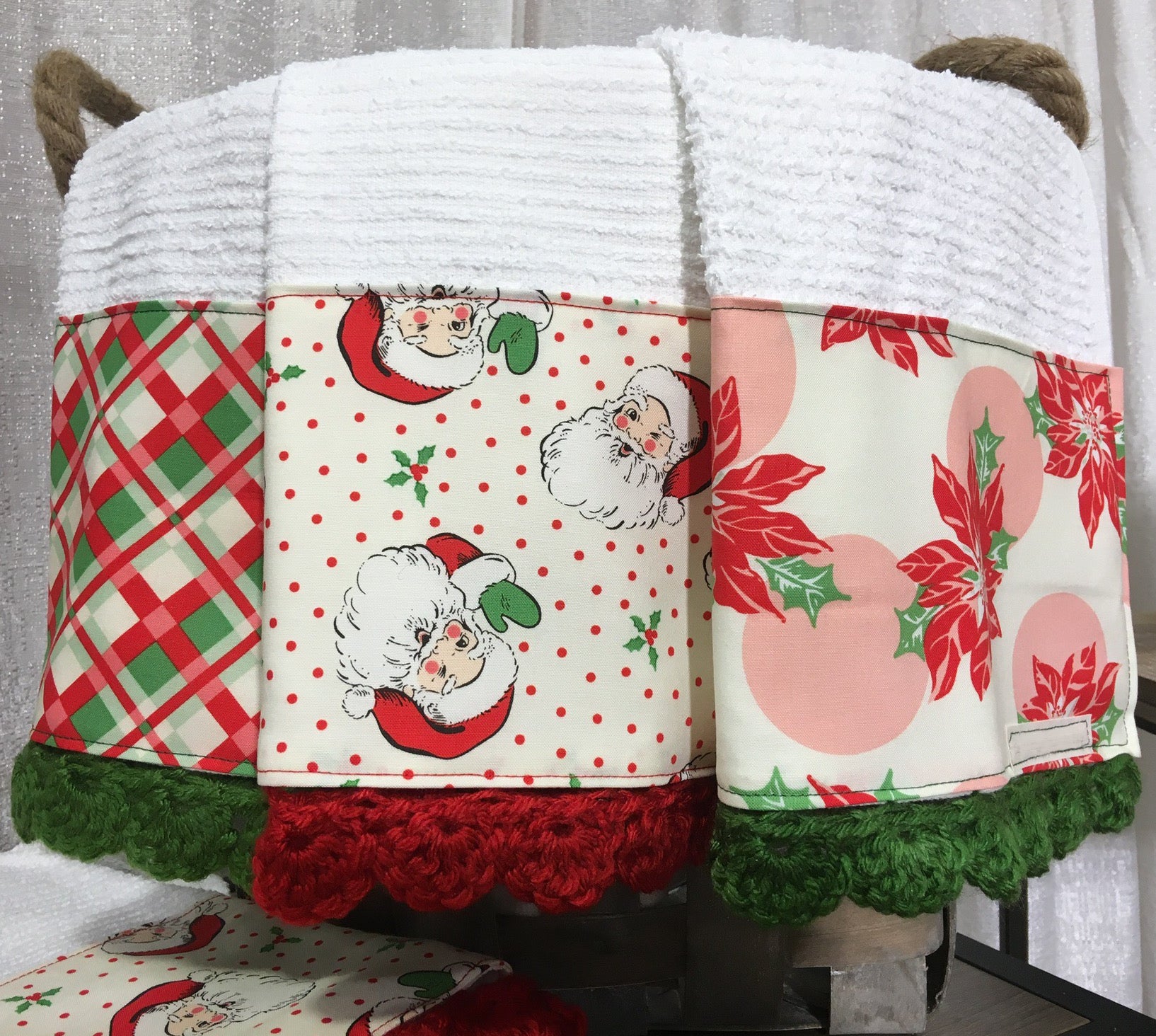 https://theholidaybarn.com/cdn/shop/products/retro-christmas-kitchen-towels-with-plaid-jolly-santa-and-poinsettias.jpg?v=1543898093